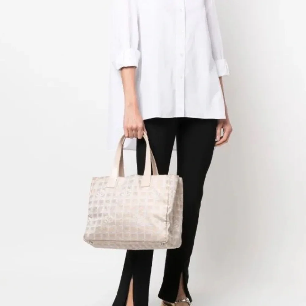 Chanel Travel Line tote in light beige / pale pinkish canvas